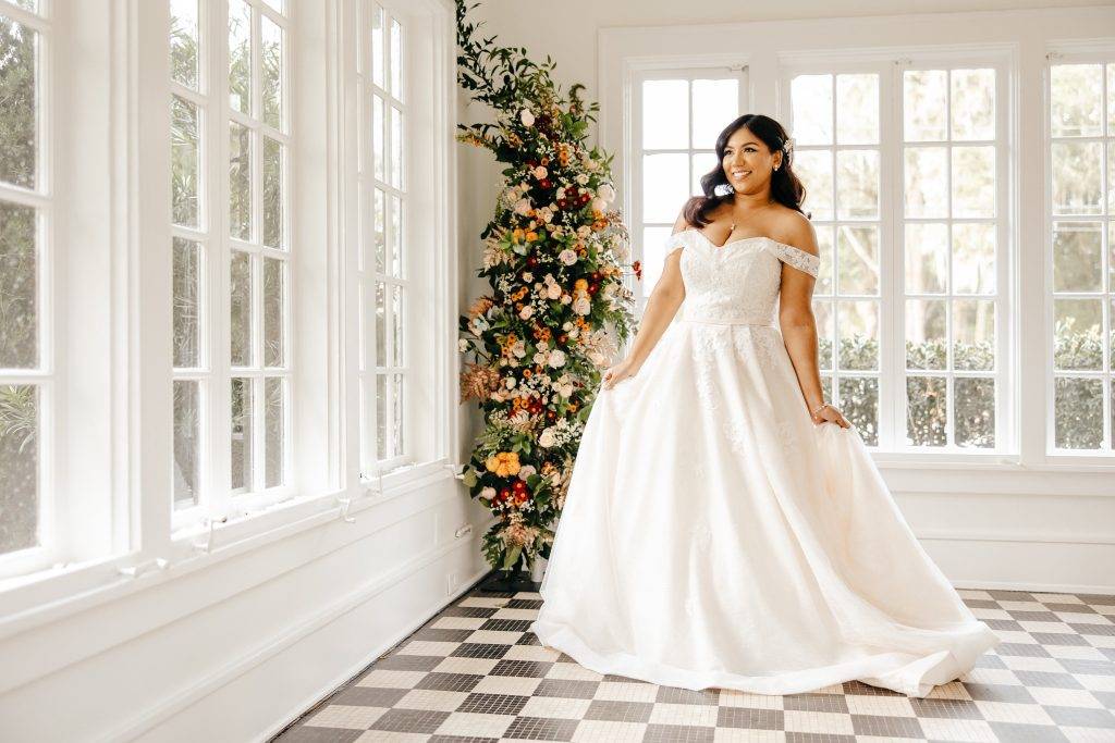 Black &amp; White tile sunroom wedding day portrait