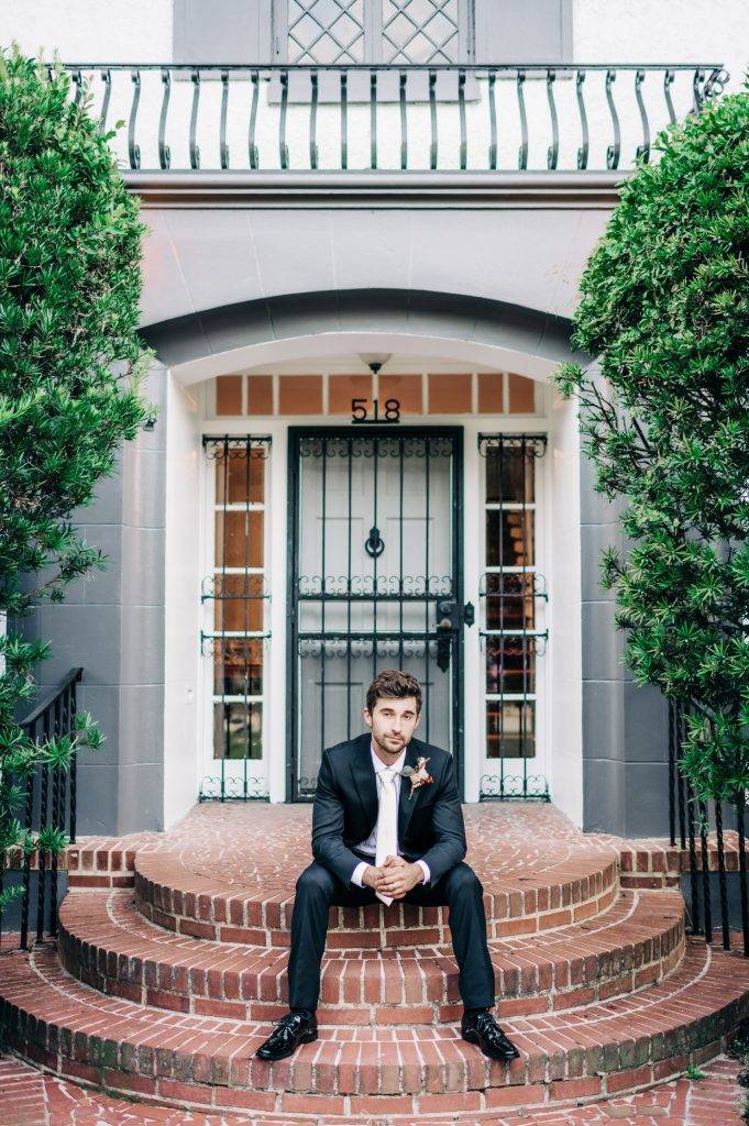 Groom on front steps of main villa