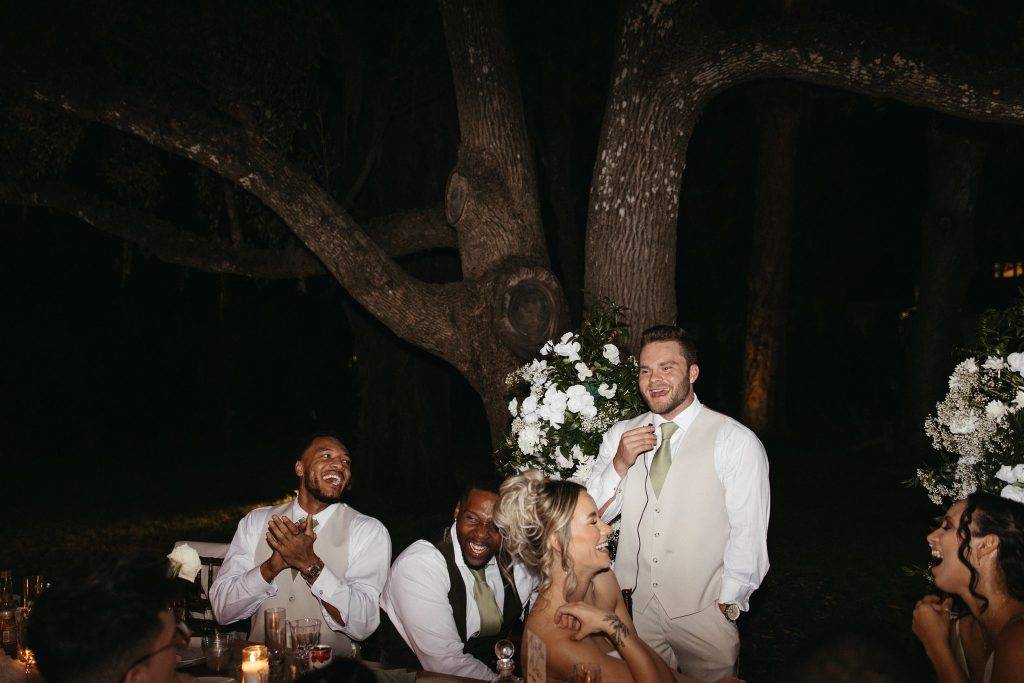 Toasts in the outdoor covered wedding reception area