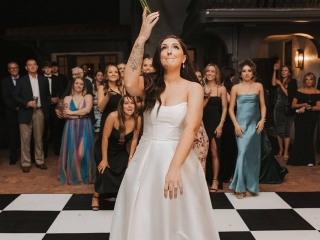 Outdoor wedding reception toss