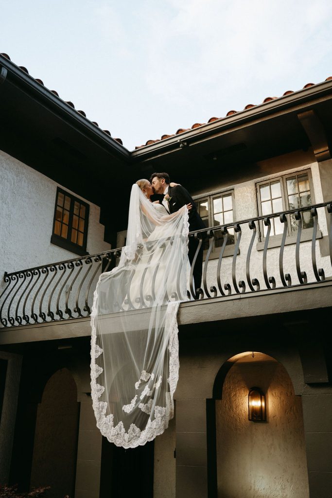 Wedding couple on Villa Festa balcony